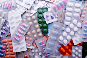 Colorful Assortment Of Medicine Tables & Capsules.